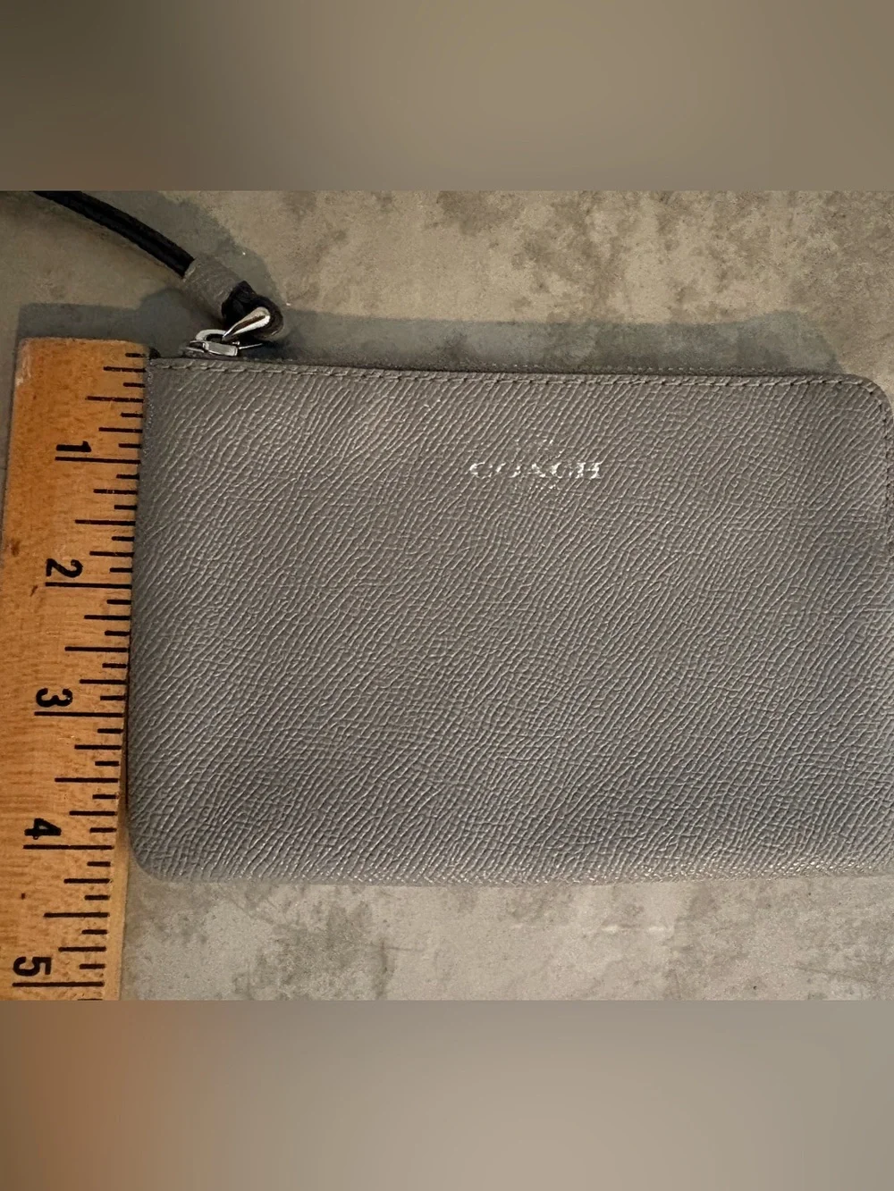 Coach Corner Zip wristlet in a metallic crossgrain leather